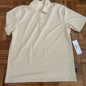 Cream colored Saturdays NYC polo